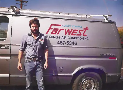 Archival photo of a Farwest Heating and Air Conditioning van lettered 457-5346, with a man in work clothes standing beside it